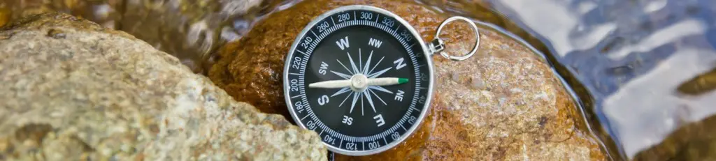 Compass resting on wet stones - proven results